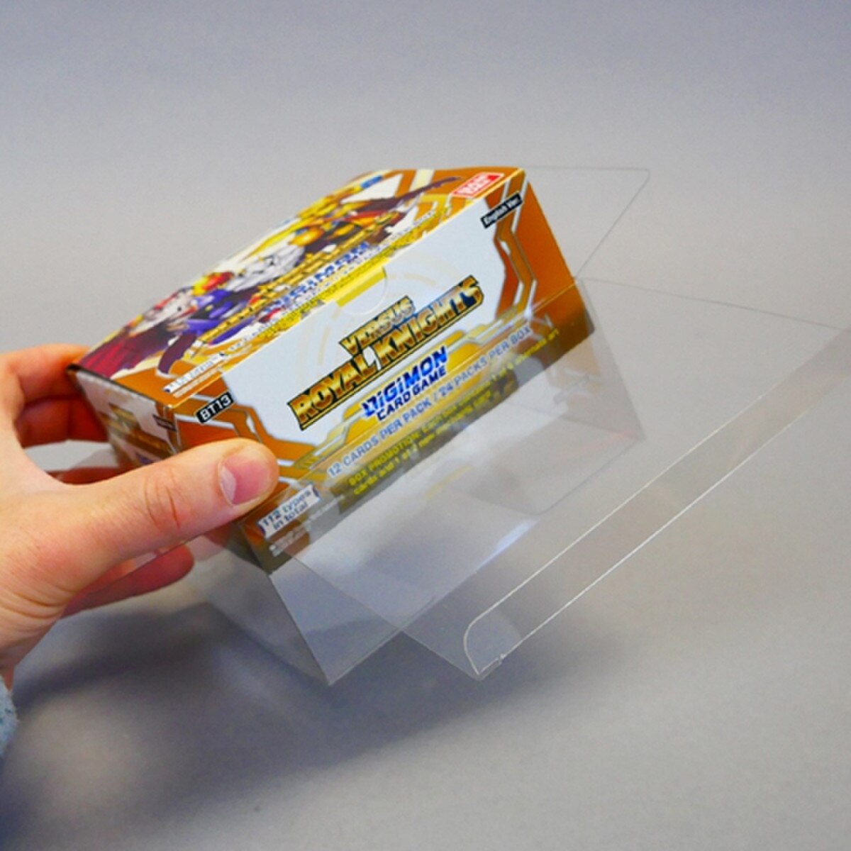 DIGIMON Booster Box in clear box.